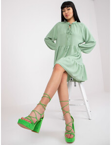 Fashionhunters Ανοιχτό πράσινο φόρεμα σε boho στυλ με διακοσμητικά στοιχεία