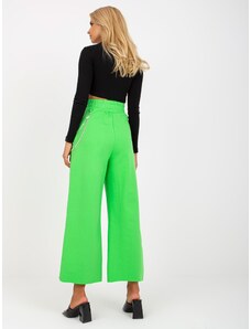 Fashionhunters Ανοιχτό πράσινο φαρδύ παντελόνι με τρύπες