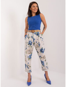 Fashionhunters Light beige fabric trousers with a floral print